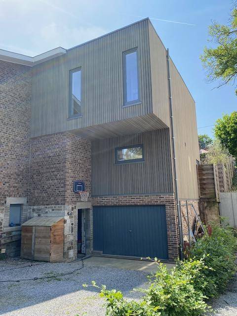 Extension - rehaussement en structure et bardage bois d'une maison unifamiliale dans la région de Mery (1)